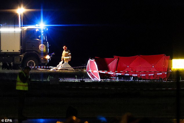 Rescue services, firefighters and soldiers work at the scene of the accident