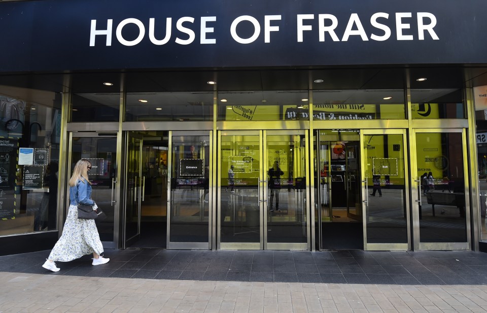 Woman entering a House of Fraser department store.
