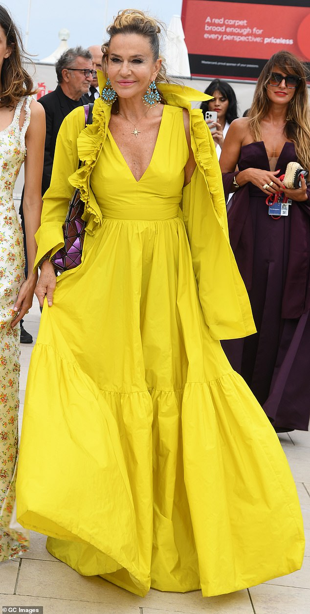 Italian actress Eva Robin commanded attention in a bright yellow gown as she attended the Venice Film Festival on Thursday