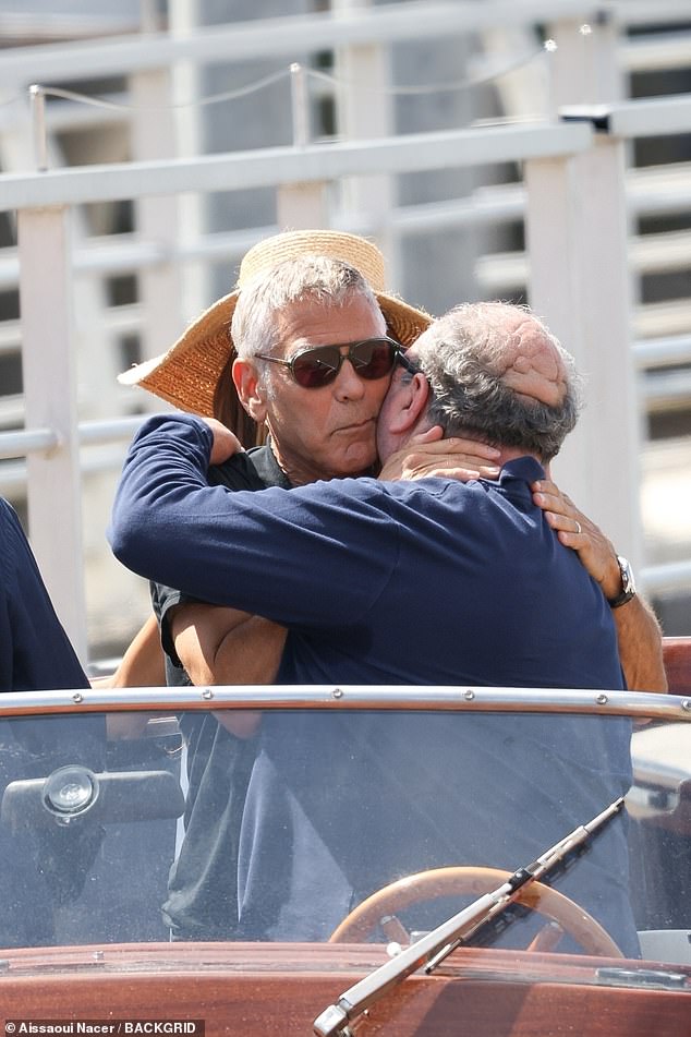 George seen giving the boat driver a hug