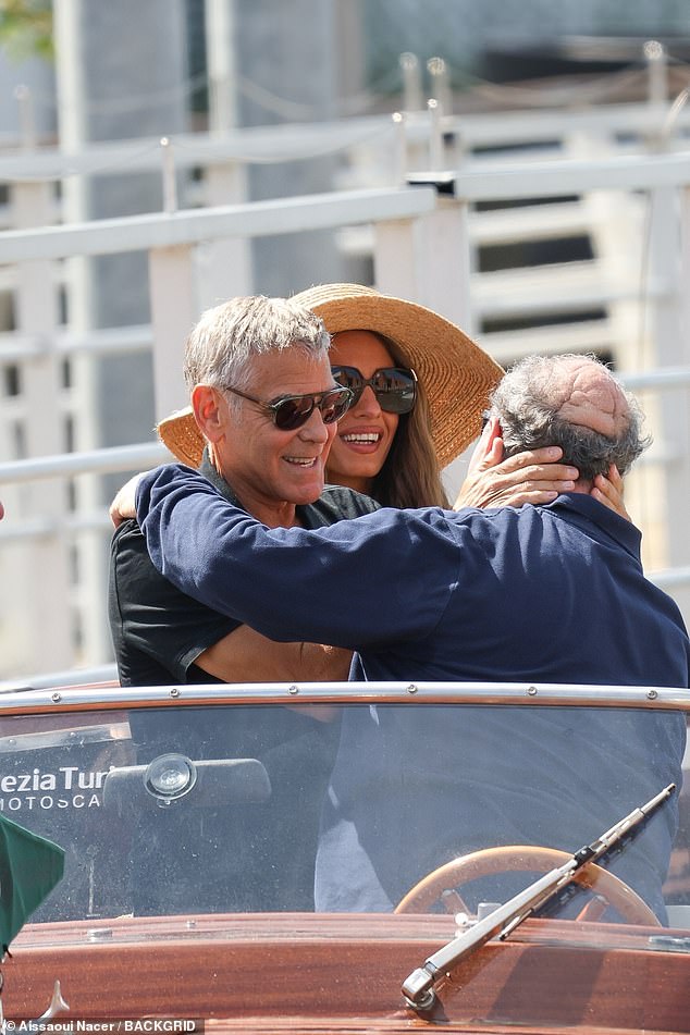The couple were smiling as they said goodbye