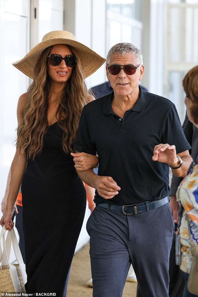 George kept his eyes shielded with a pair of sunglasses