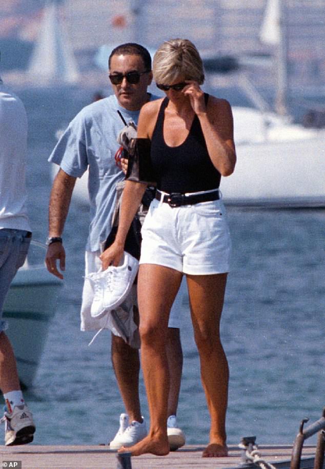 Princess of Wales, right, and Dodi Fayed, walk on a pontoon in the French Riviera resort of St Tropez in this Friday, Aug. 22, 1997