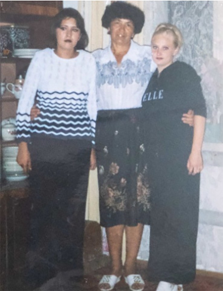 Photo of three women standing together.
