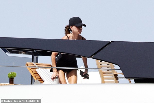 Victoria looked in great spirits as she watched on while her son displayed his skills