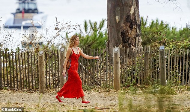 The actress, 35, stunned in a red polka-dot maxi dress