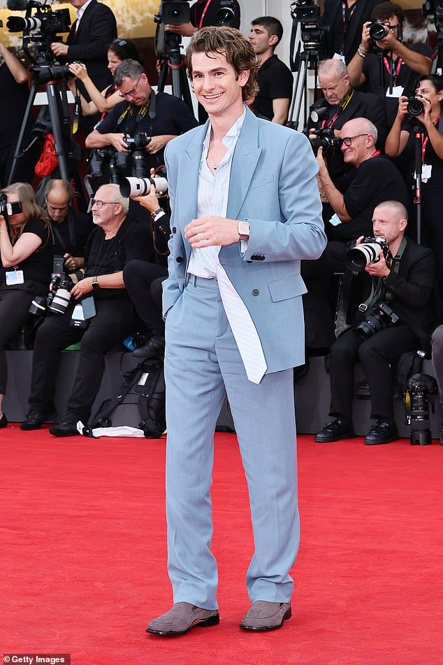 Andrew appeared in top spirits as he stepped out onto the red carpet wearing a pale blue two-piece suit