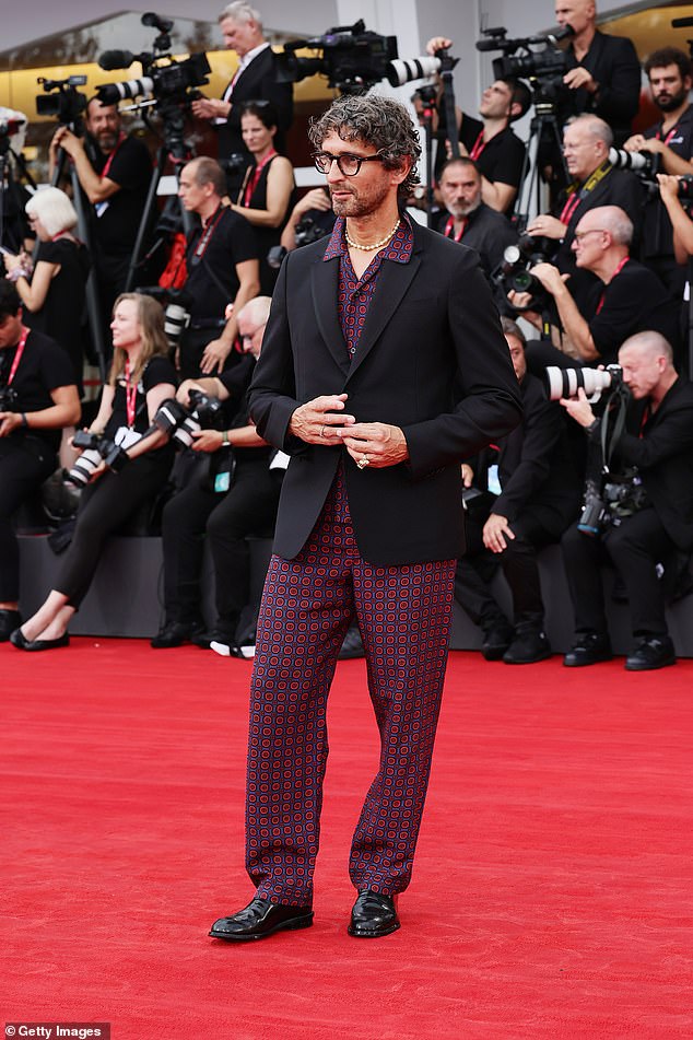 Simone Marchetti showcased his quirky fashion sense in red and blue patterned trousers, a matching shirt and a black blazer