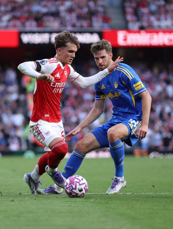 Arsenal's Max Robert Dowman fouled by Leeds United's Anton Stach.