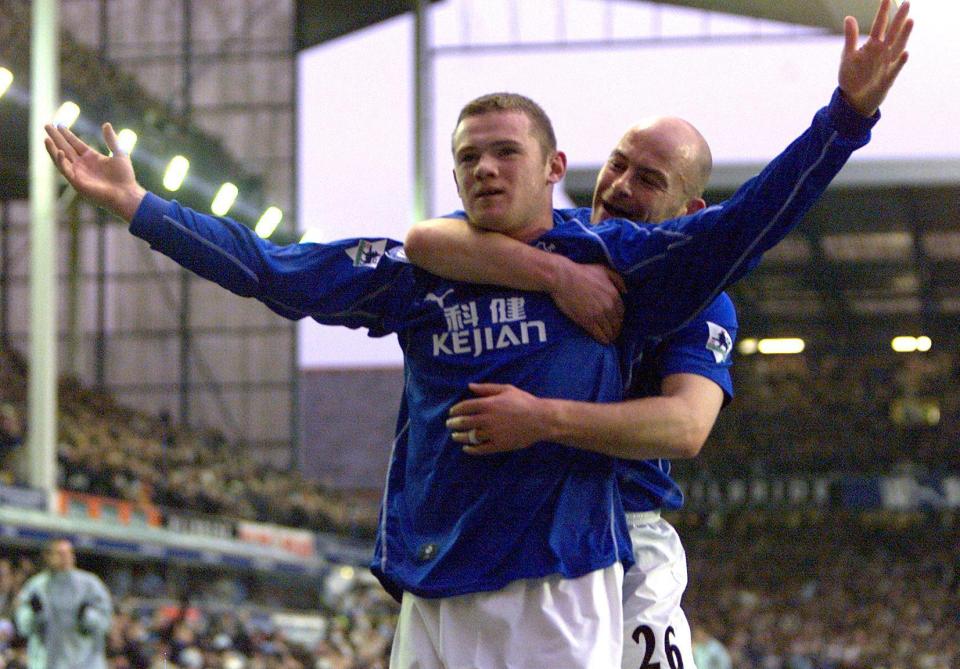 Wayne Rooney and Lee Carsley celebrating a goal for Everton.