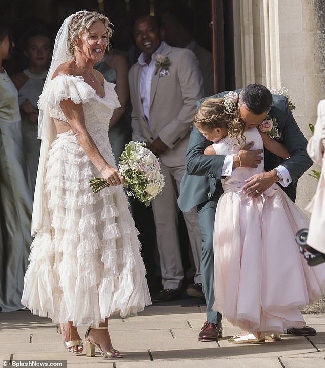 Mark shared a sweet moment with daughter Nancy following the ceremony