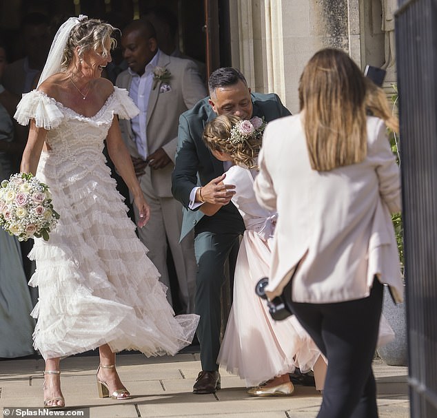 Meanwhile Lorraine and Mark's daughter Nancy, ten, looked lovely as their flower girl in a pale pink princess dress with flowers in her hair