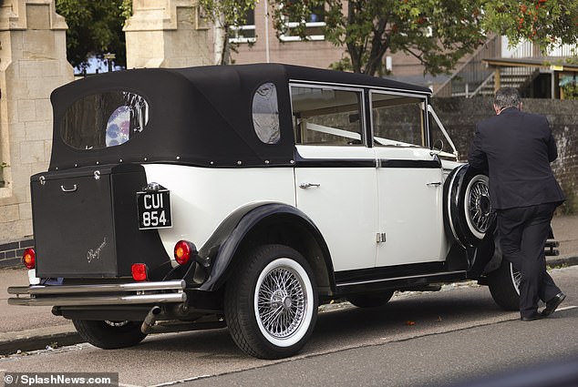 The bride and groom left in a vintage car