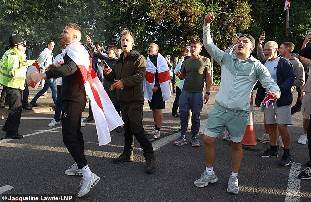 Elsewhere, anti-migrant demonstrators protested wearing St George's flags outside The Delta Marriott Hotel in Cheshunt