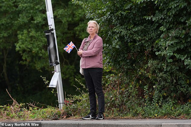 A protester holding a Union Jack flag near the Bell Hotel this afternoon