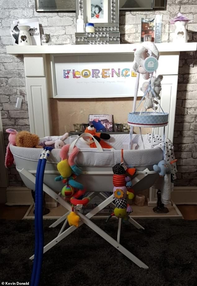 Pictured: Upton's living room which features a cradle and toys as well as an ode to her daughter Florence, who was stillborn