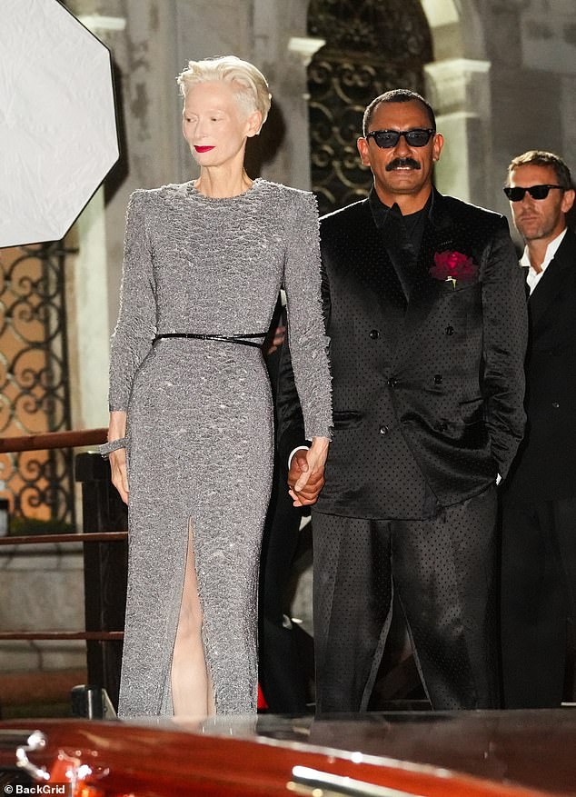 Also in attendance was Tilda, 64, who arrived holding hands with the creative director of the fashion house, Haider Ackermann