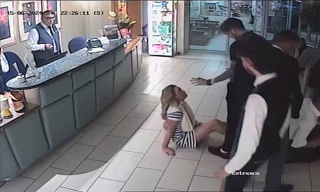 When he rejected Williamson's advances, Poole Magistrates' Court heard, she 'acted like a woman possessed', swiping drinks, glasses and a candle from the table (pictured: CCTV footage of a staff member having to intervene)