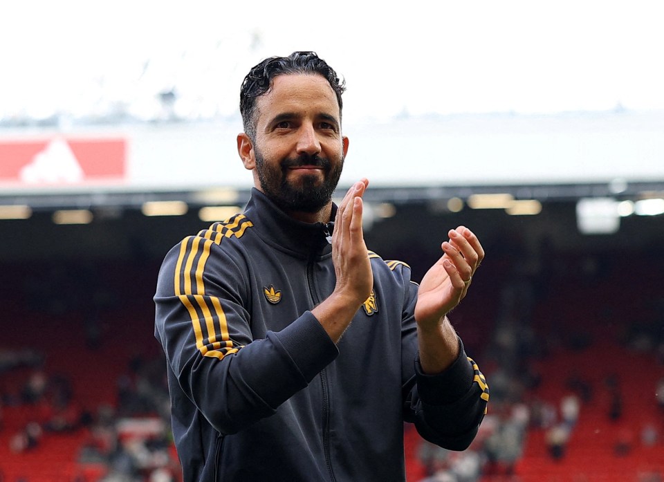 Ruben Amorim applauding after a Manchester United match.
