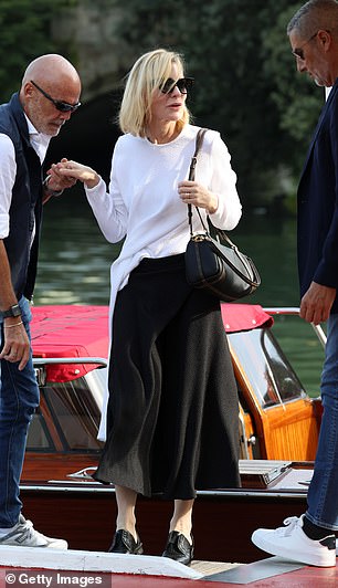 Cate was happy to be helped off her aquatic transport by two assistants, stopping for a chat as she disembarked