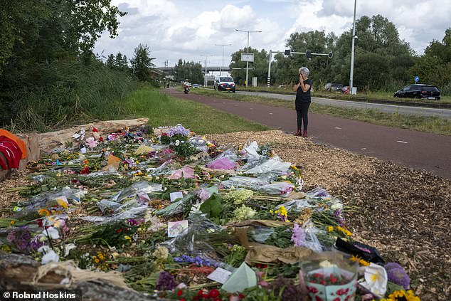 Swathes of flowers (above) have been left where Lisa, a talented, popular, hockey-mad, tennis-loving young girl, died