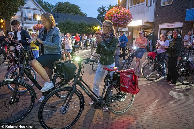 Emotional gatherings (seen above) have taken place throughout Holland after Lisa's death as it has touched the general public so profoundly