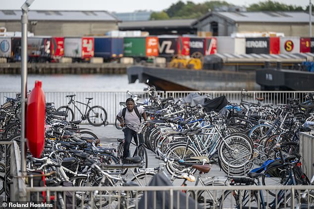 Dozens of bicycles (above) were spotted outside the Bibby Renaissance accommodation barge moored near Amsterdam