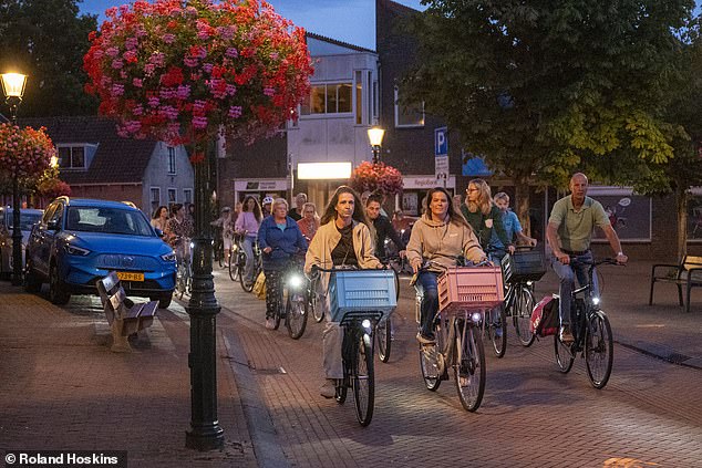 Dozens of distraught men and women (above) cycled late at night to promote women's safety after Lisa died in the early hours of the morning