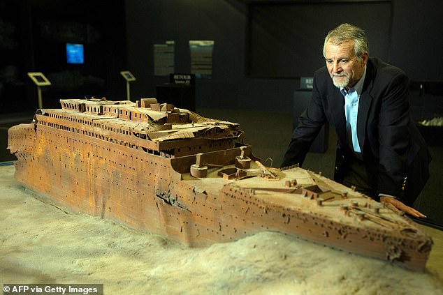 Henri Nargeolet, the director of a deep ocean research project dedicated to the Titanic, is seen looking at a model of the famous liner