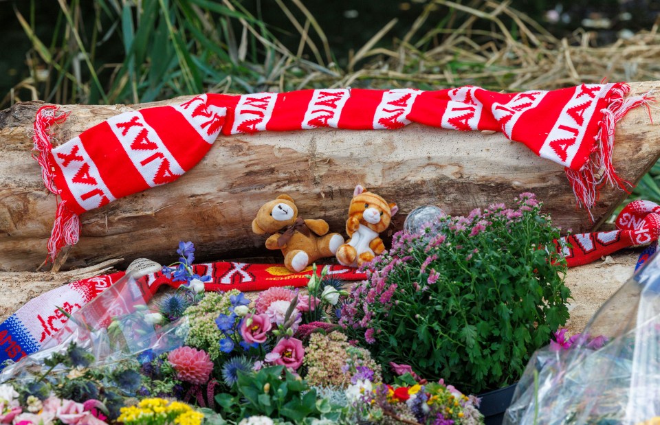 Tributes at a cycle path where a teenager was murdered.