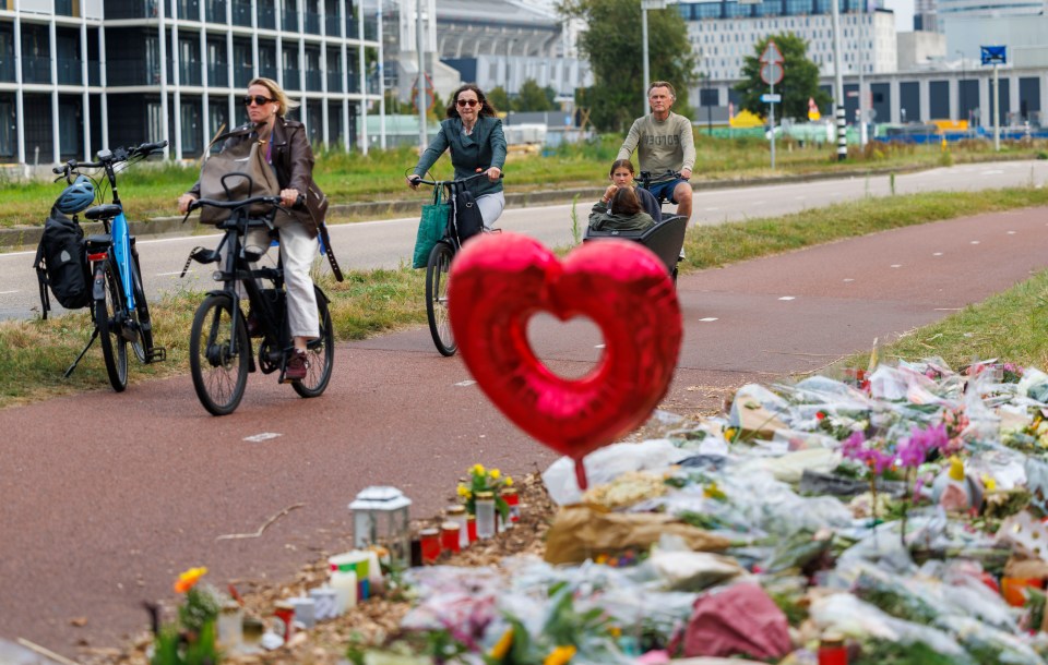 Tributes at a cycle path where a teenager was murdered.