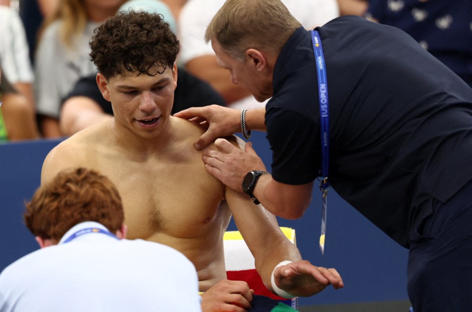 Ben Shelton receiving medical attention at the US Open.