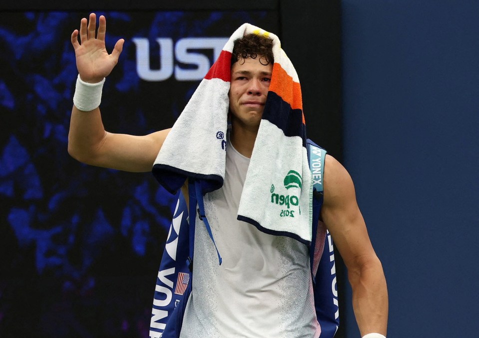 Ben Shelton of the U.S. crying after retiring from a tennis match due to injury.