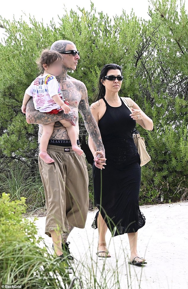 Travis and Kourtney were hand-in-hand on the outing