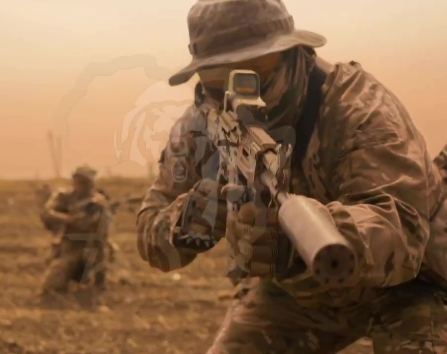 Wagner Group recruitment video still image: soldiers aiming rifles.