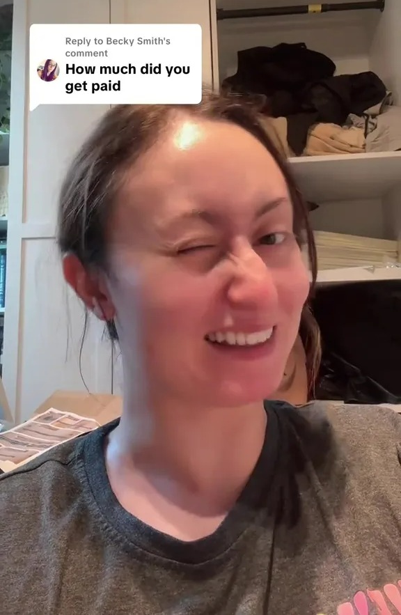 Woman winking, responding to a question about how much she was paid for a 12-word role as an extra on Hollyoaks.