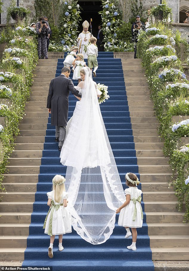 The royal opted for the most traditional of bridal accessories - a long, flowing veil to accompany her white gown