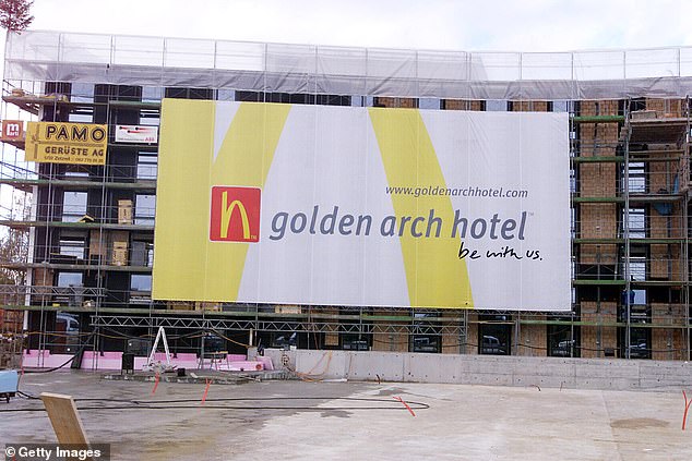 From the outside, guests were greeted by a sleek, grey exterior with tall windows and a large sign reading 'Golden Arch Hotel'