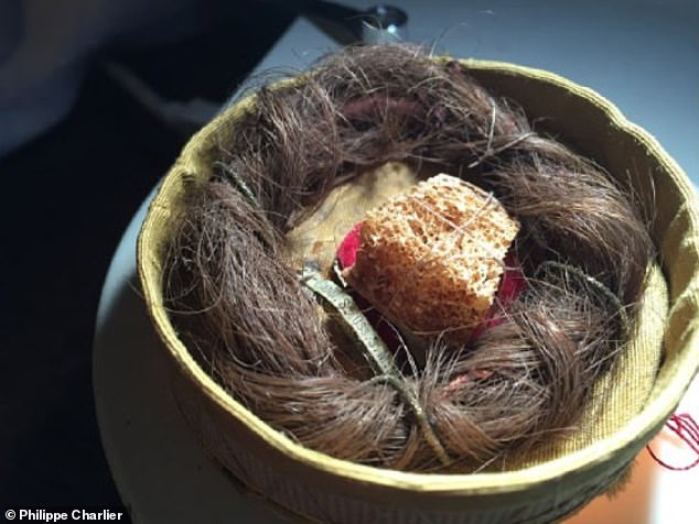 Mary's hair was long and dark, although she probably wore it braided and bound up. Pictured: hair found in Provence that may have belonged to Mary Magdalene