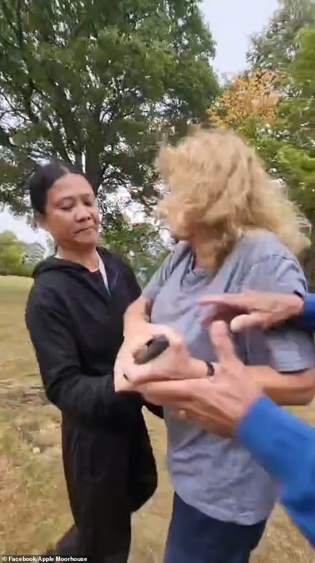 The mother then tried to grab her phone back from the woman, who is wanted by the police