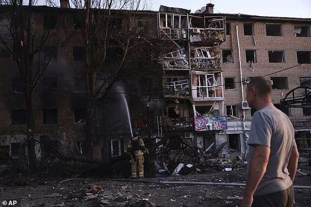 A resident looks at his destroyed home following Russian air strike in Zaporizhzhia, Ukraine, Saturday, Aug. 30, 2025