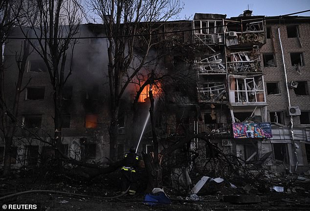 A firefighter works at the site of an apartment building hit during a Russian drone and missile strike, amid Russia's attack on Ukraine, in Zaporizhzhia, Ukraine August 30, 2025