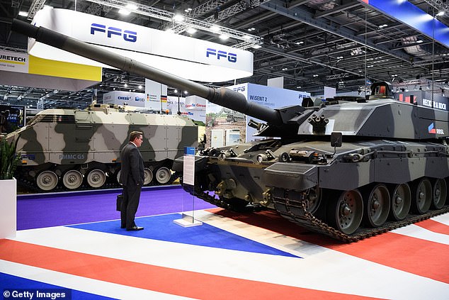 The DSEI UK exhibition is scheduled for September 9-12 in London. Pictured: A delegate studies a Challenger II tank on day two of the DSEI arms fair at ExCel on September 11, 2019 in London, England