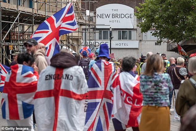 Demonstrators gather during an anti-immigration protest outside the New Bridge Hotel in Newcastle
