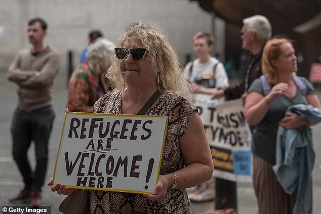 A counter-demonstration protest gathers to face an anti-immigration protest outside the New Bridge Hotel in Newcastle on August 30