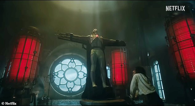 There's a glimpse of the Australian 27-year-old masked while standing, crucifix-like, during Dr. Victor Frankenstein's (R, Oscar Isaac) reviving, electrical experiment
