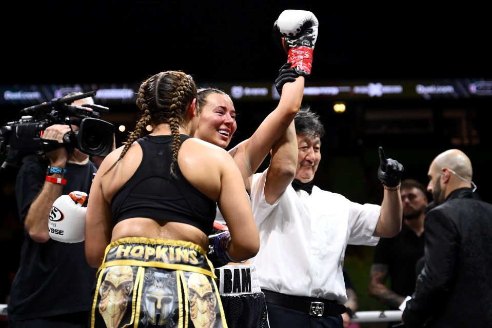 Demi Sims celebrates her middleweight victory.