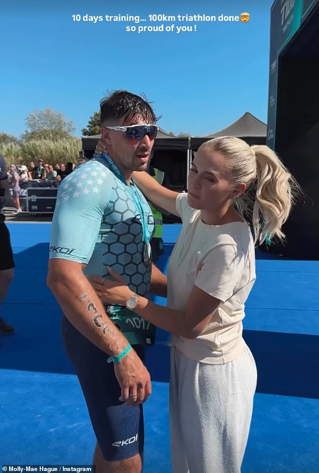 The Love Island star gushed how proud she was after the boxer completed the 100km challenge on foot, bike and swimming, after just 10 days of training