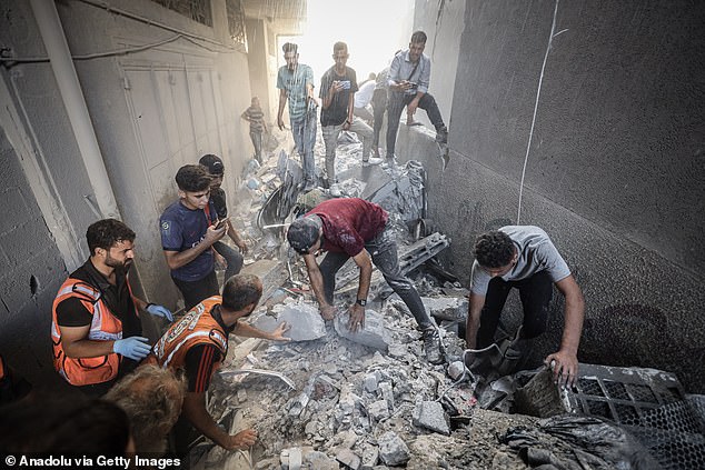 Palestinians hold search and rescue efforts for people injured in the attack on the region