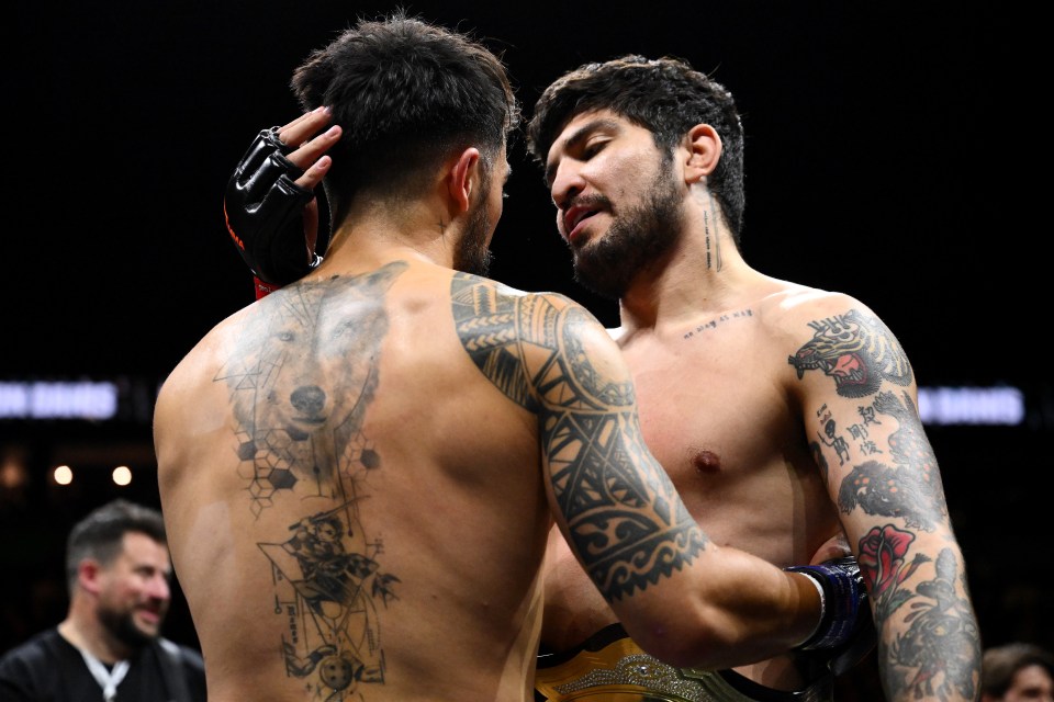 Dillon Danis and Warren Spencer embrace after a fight.